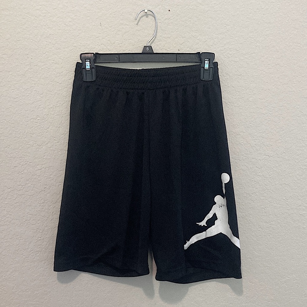 Air Jordan black shorts with white Jordan label on left short leg